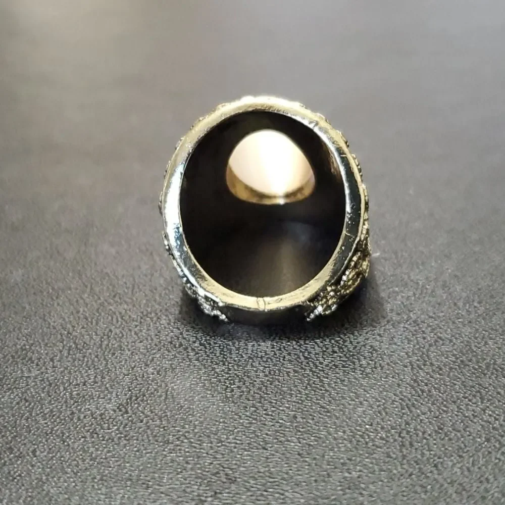 Gold tone ring with stone